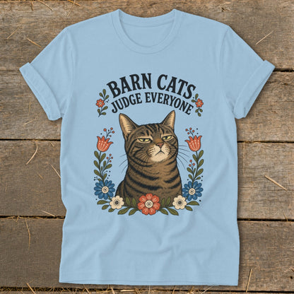 Light blue t-shirt with a judgmental cat and the text "BARN CATS JUDGE EVERYONE."