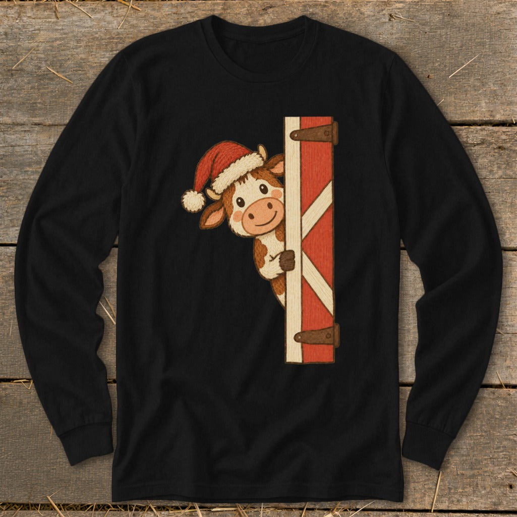 Black long-sleeve shirt with a cartoon cow wearing a Santa hat peeking from behind a red barn door.