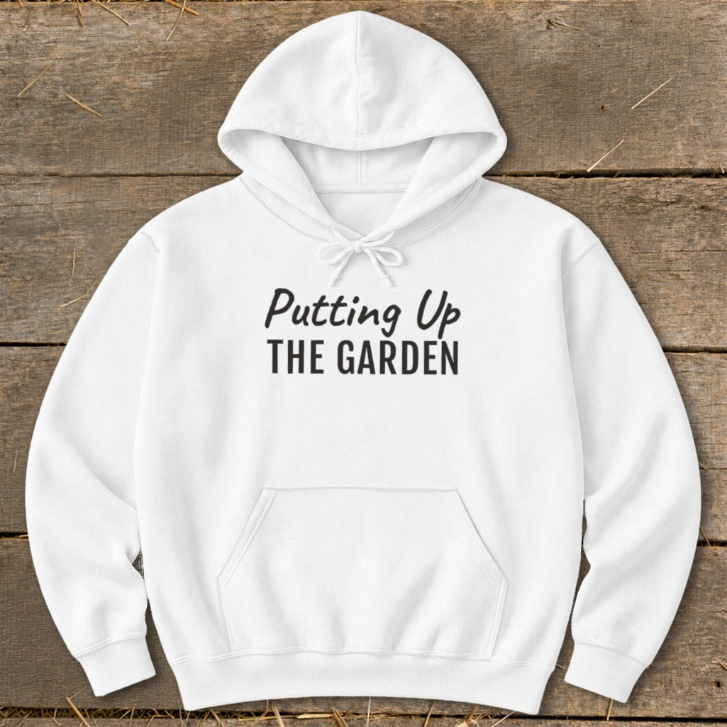 White hoodie with "Putting Up THE GARDEN" printed on the front.