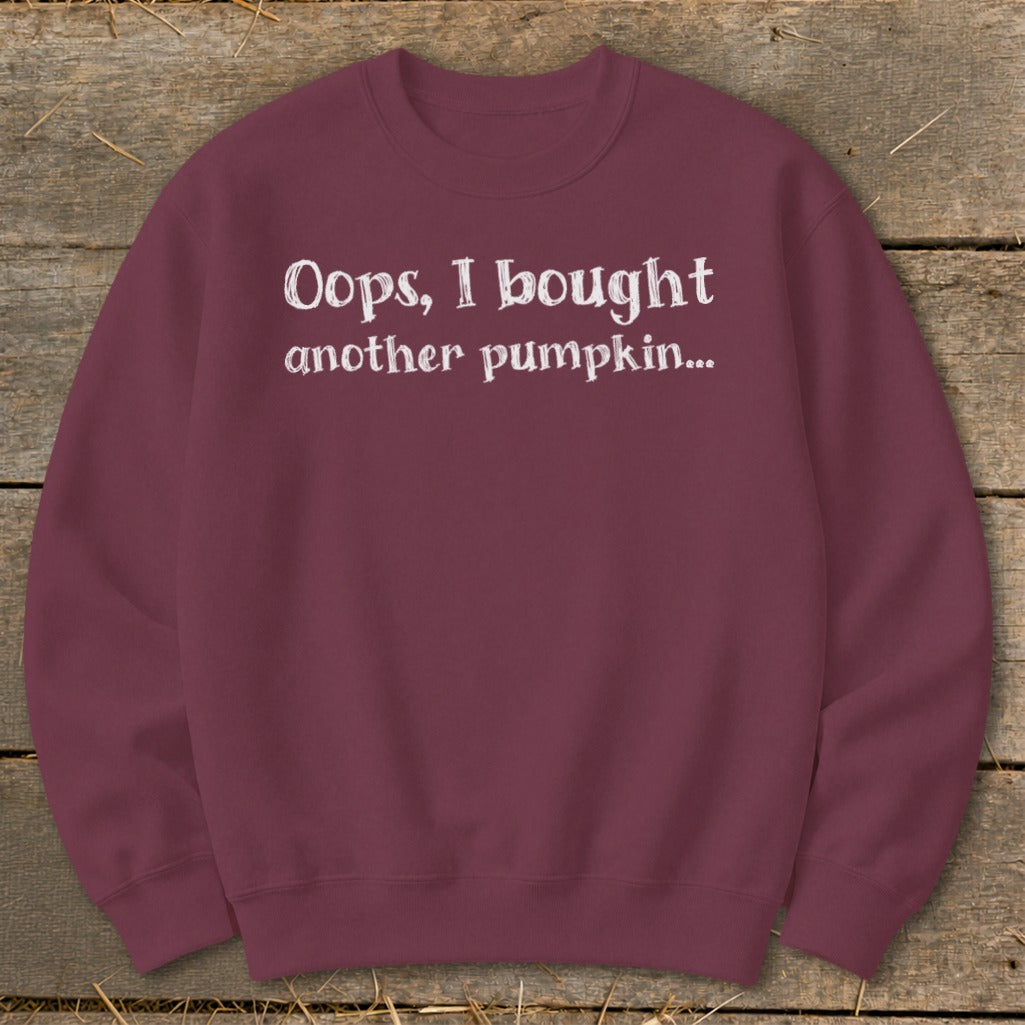 Maroon sweatshirt with white text "Oops, I bought another pumpkin..."