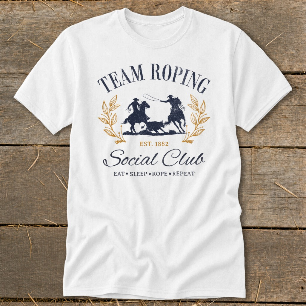 White t-shirt with "Team Roping Social Club Est. 1882" graphic.