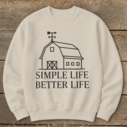 Cream sweatshirt with a black barn graphic and "Simple Life Better Life" text.