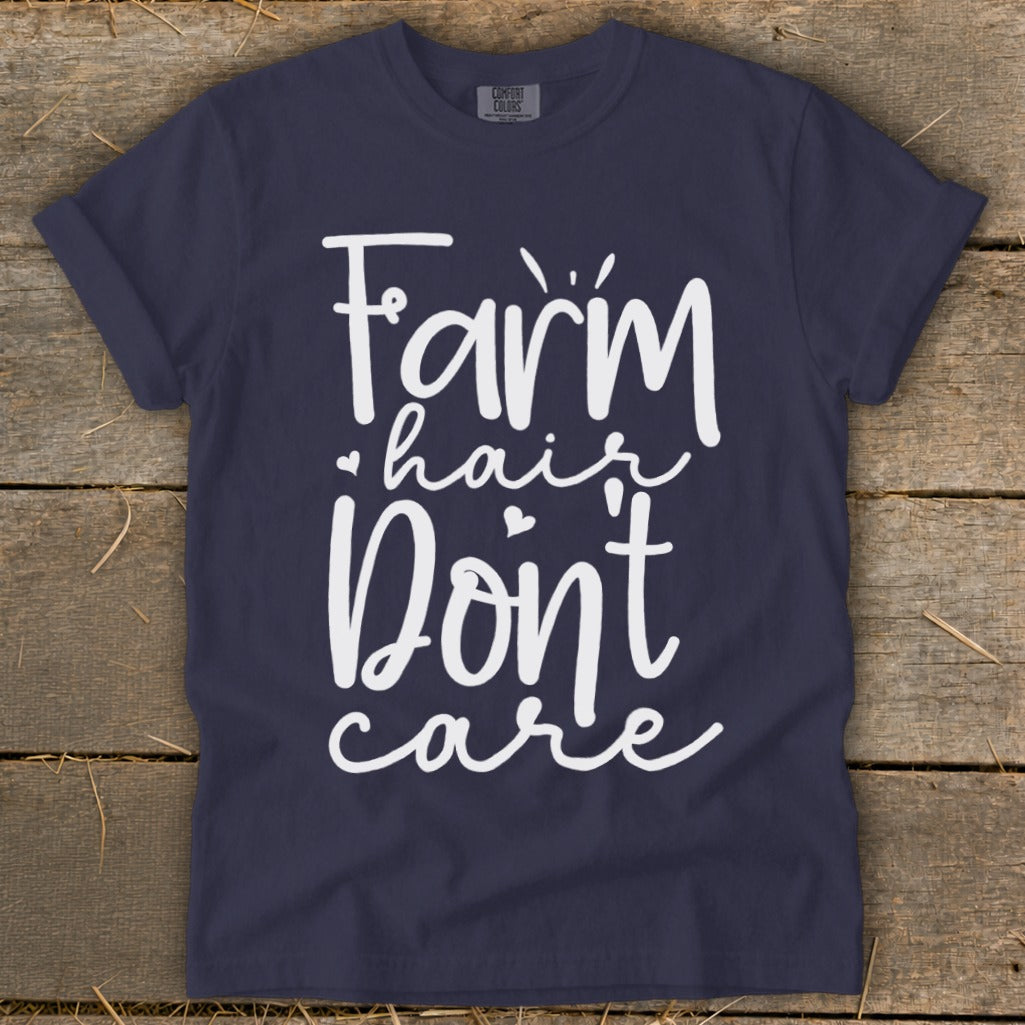 Navy t-shirt with white text that reads "Farm hair don't care".