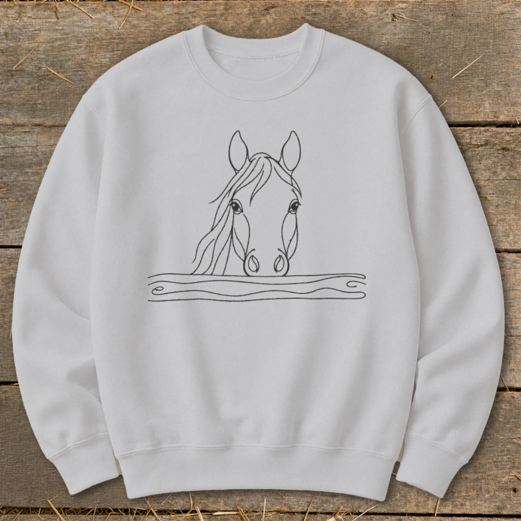 White crewneck sweatshirt with a black line drawing of a horse's head peeking over wavy lines.