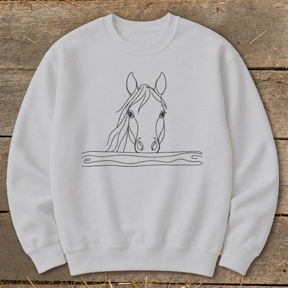White crewneck sweatshirt with a black line drawing of a horse's head peeking over wavy lines.