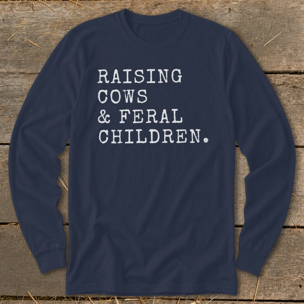 Navy long sleeve shirt with white text "RAISING COWS & FERAL CHILDREN."