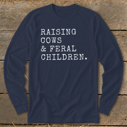 Navy long sleeve shirt with white text "RAISING COWS & FERAL CHILDREN."