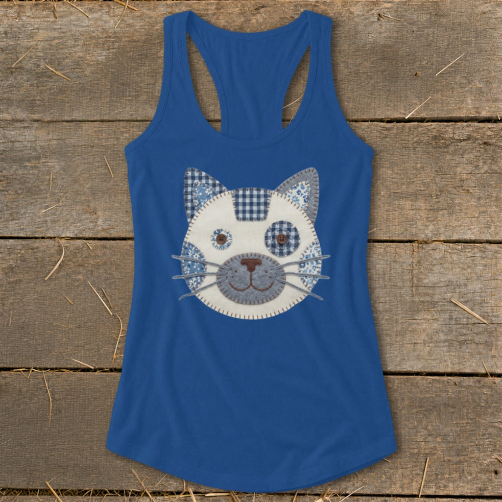 Blue tank top with a patchwork cat face applique design.
