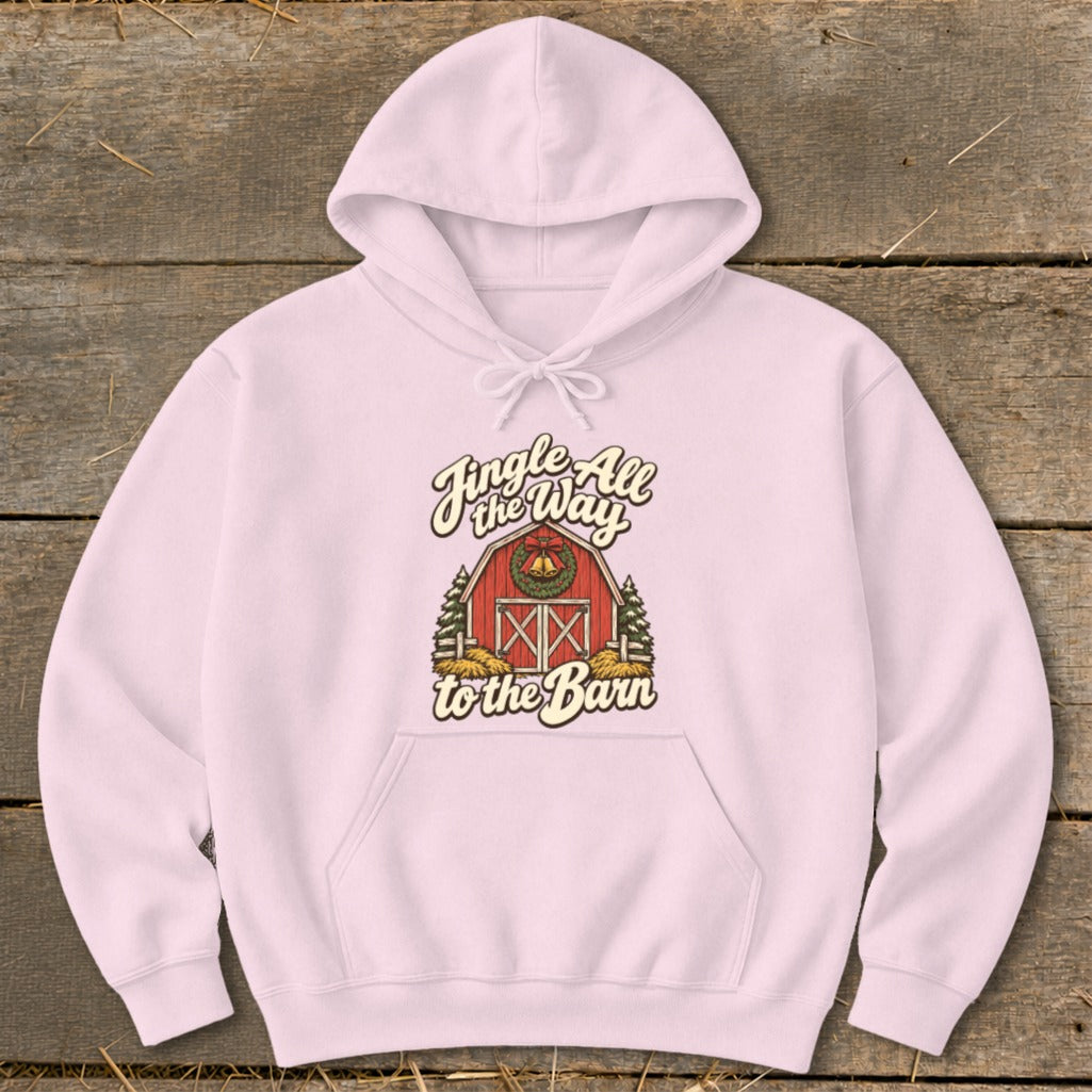 Pink hoodie with a graphic of a red barn and trees with the text "Jingle All the Way to the Barn".