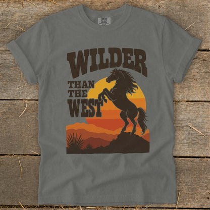 Grey t-shirt with "WILDER THAN THE WEST" text and rearing horse silhouette.