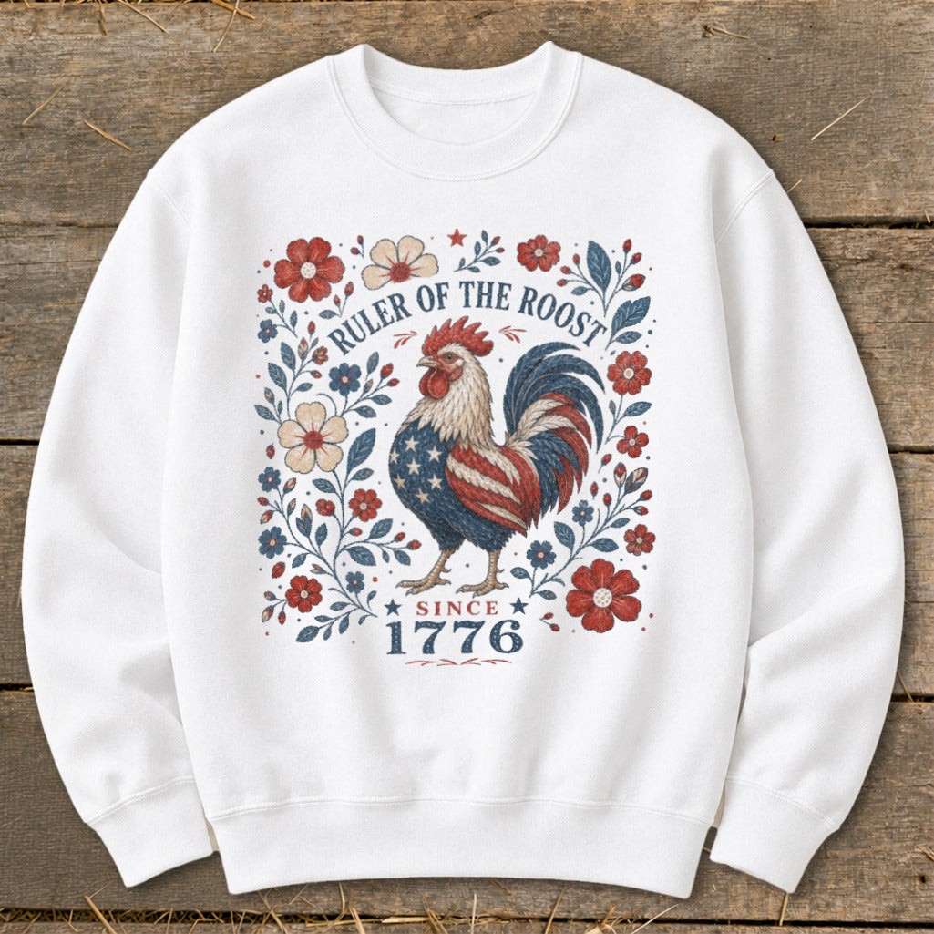 White sweatshirt with patriotic rooster design and "Ruler of the Roost Since 1776" text.