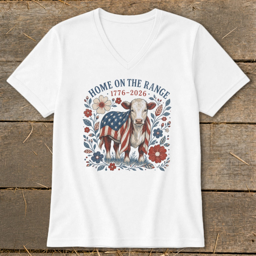 White v-neck t-shirt with patriotic cow and floral design, reads "Home on the Range 1776-2026".