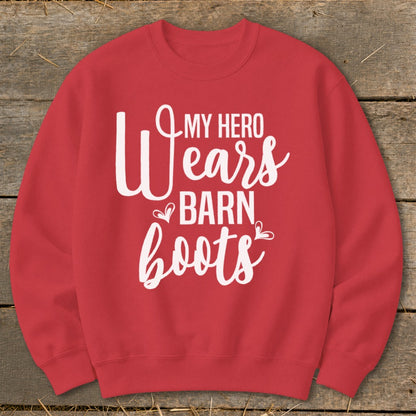 Red sweatshirt with white text reading "My Hero Wears Barn Boots".