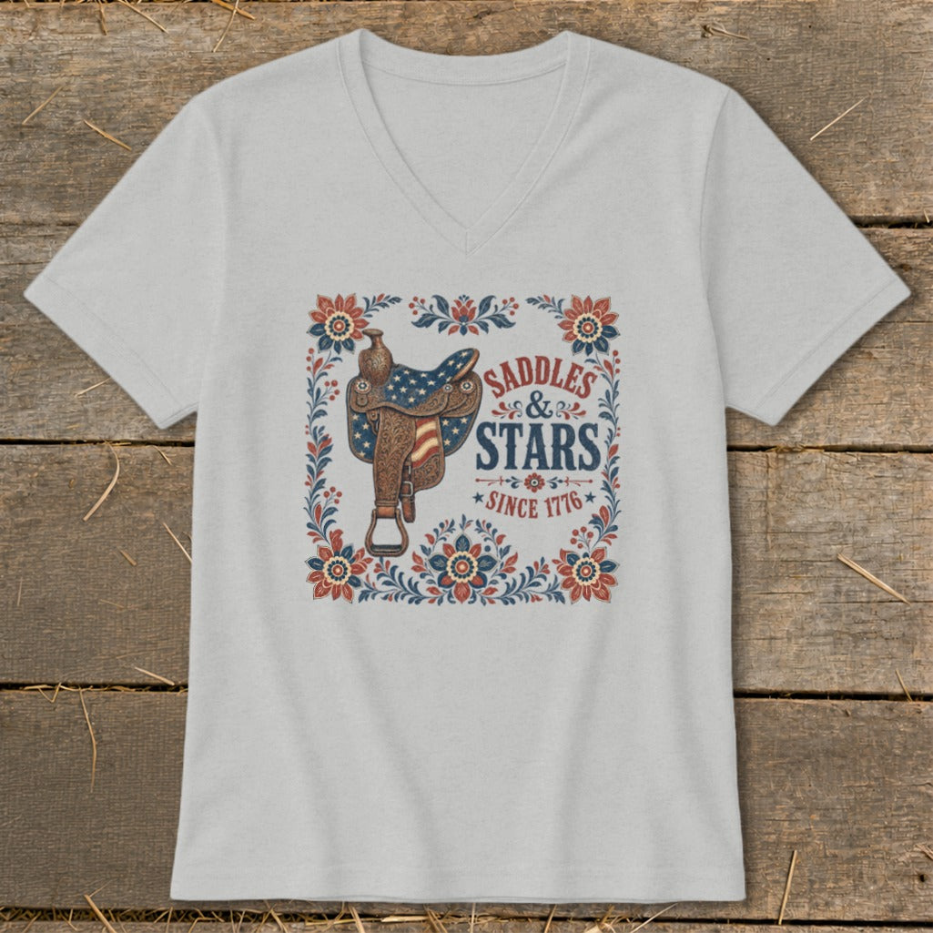 Gray v-neck t-shirt with saddle graphic, "Saddles & Stars Since 1776" text.