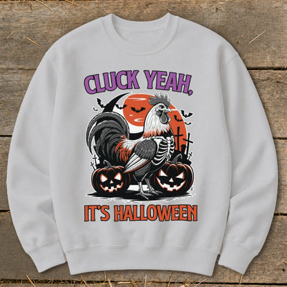 Skeleton rooster and pumpkins with text "CLUCK YEAH, IT'S HALLOWEEN".