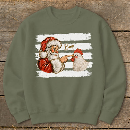 Santa Claus booping a chicken with the word "Boop" on a graphic.