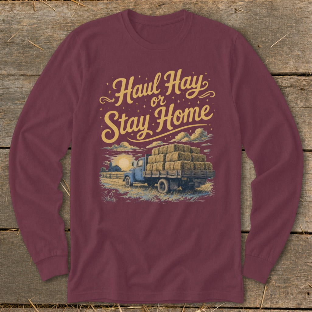 Maroon long-sleeve shirt with "Haul Hay or Stay Home" text and truck with hay bales.