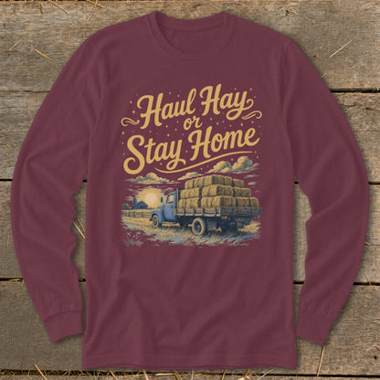 Maroon long-sleeve shirt with "Haul Hay or Stay Home" text and truck with hay bales.