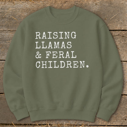 Olive green sweatshirt with white text "Raising Llamas & Feral Children."