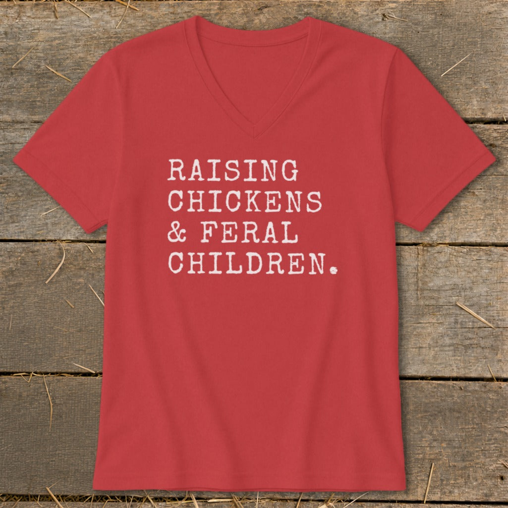 Red v-neck t-shirt with white text: "RAISING CHICKENS & FERAL CHILDREN."
