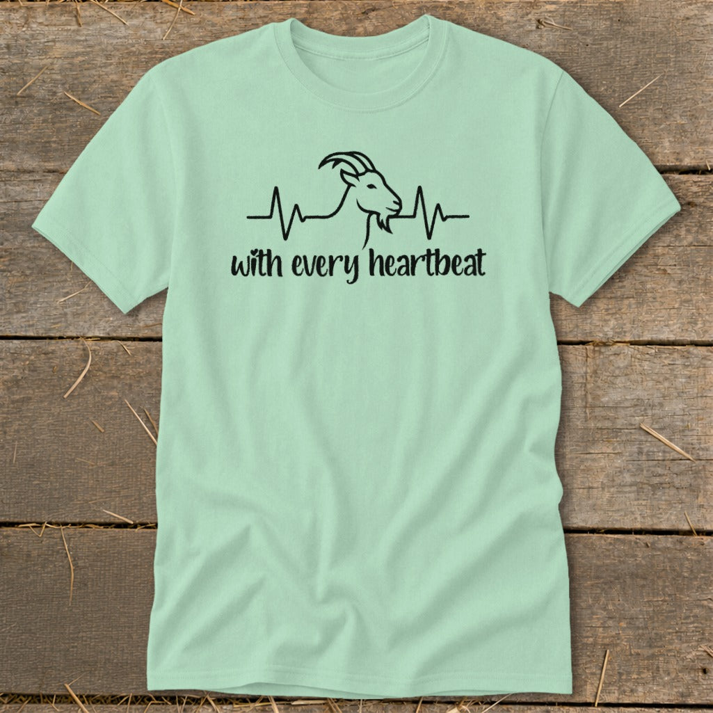 Light green t-shirt with a black graphic of a goat head in a heartbeat line and text.