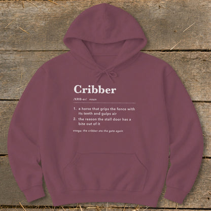 Maroon hoodie featuring white dictionary-style definition text for the word Cribber centered on the chest.