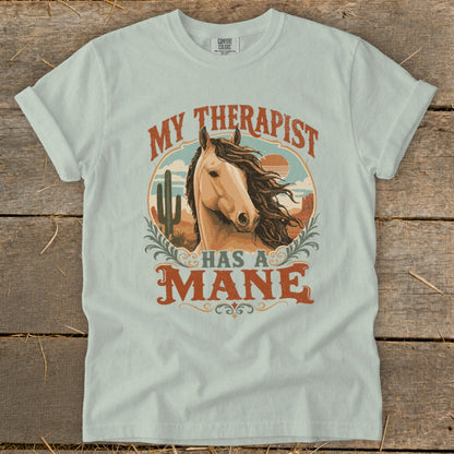 Light blue t-shirt with "My Therapist Has A Mane" text and horse graphic.