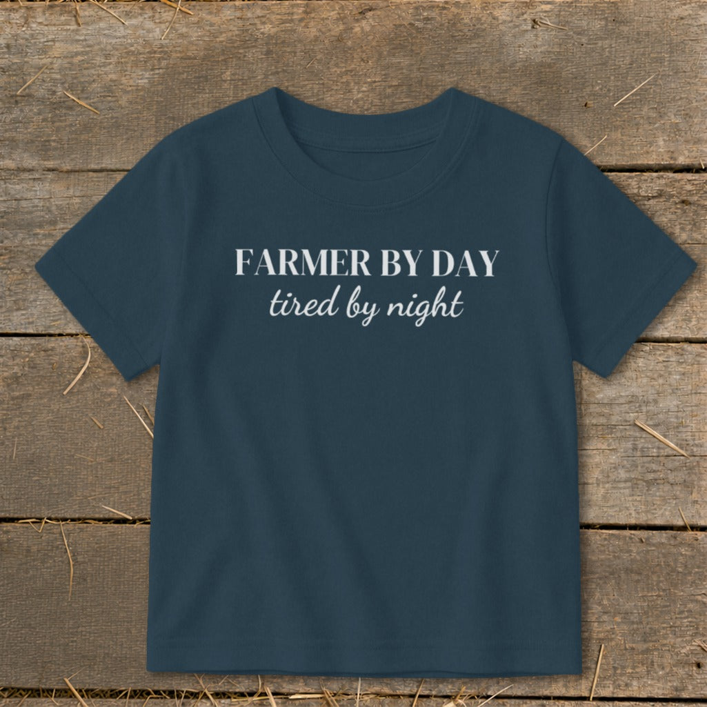 Navy t-shirt with white text reading "FARMER BY DAY tired by night".