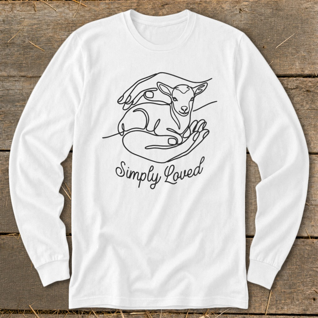 White long-sleeve shirt with "Simply Loved" text and a line drawing of a lamb cradled in hands.