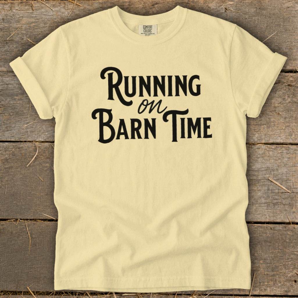 Pale yellow t-shirt with black text "Running on Barn Time"