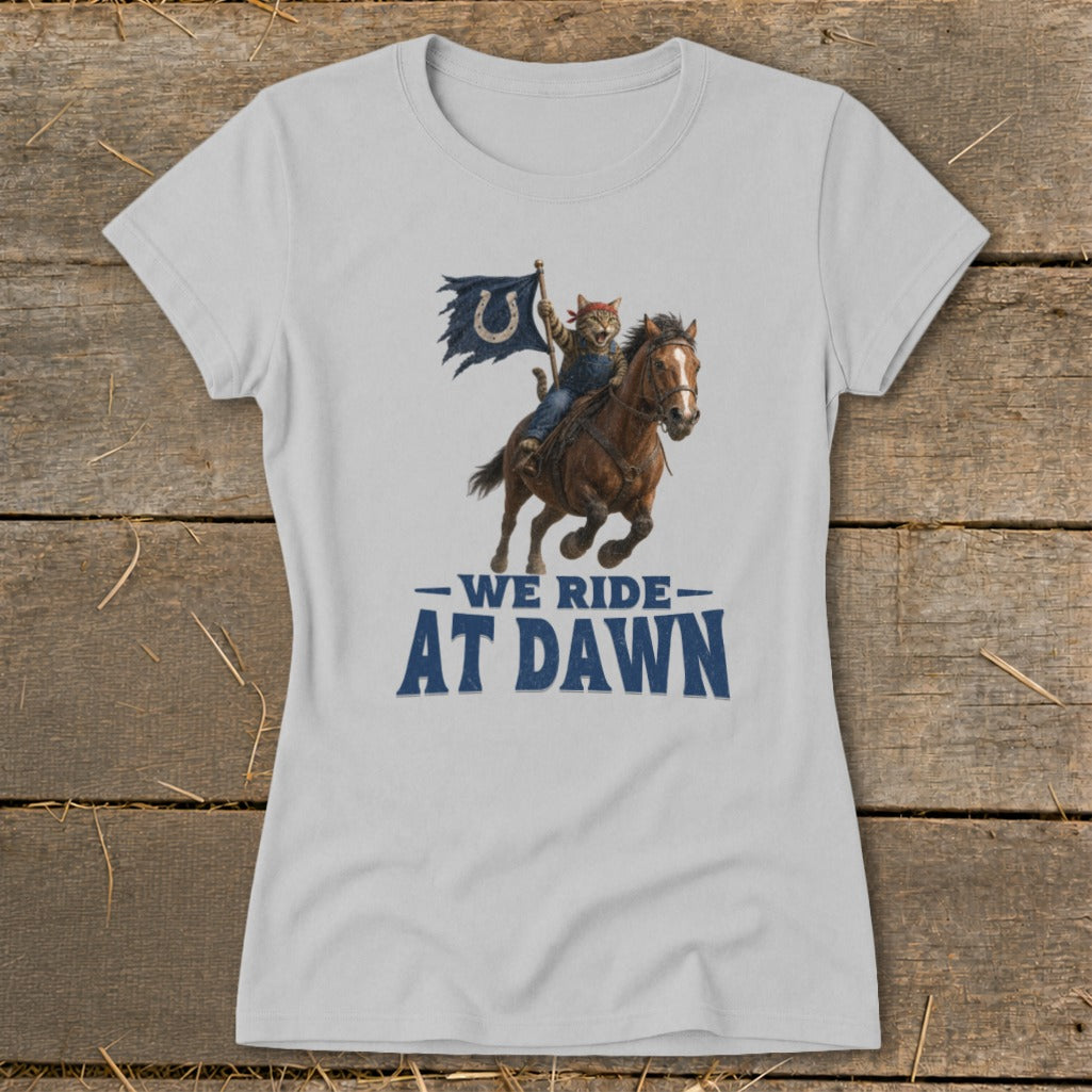Cat with Colts flag riding a horse, text "WE RIDE AT DAWN".