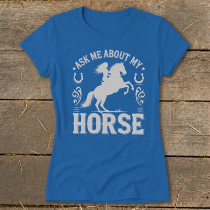 Blue t-shirt with graphic of a rider on a horse and text "ASK ME ABOUT MY HORSE".