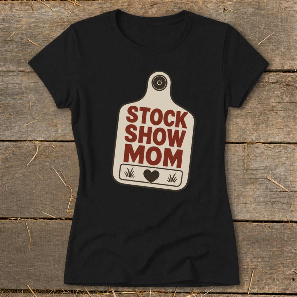Black t-shirt with "STOCK SHOW MOM" text inside a tag shape.