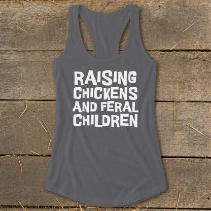 Dark gray tank top with white text reading "RAISING CHICKENS AND FERAL CHILDREN".