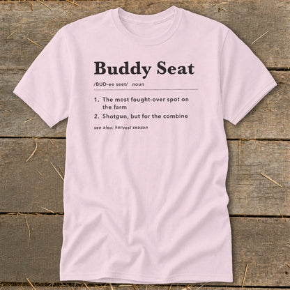 Pink t-shirt with "Buddy Seat" definition: "The most fought-over spot on the farm."