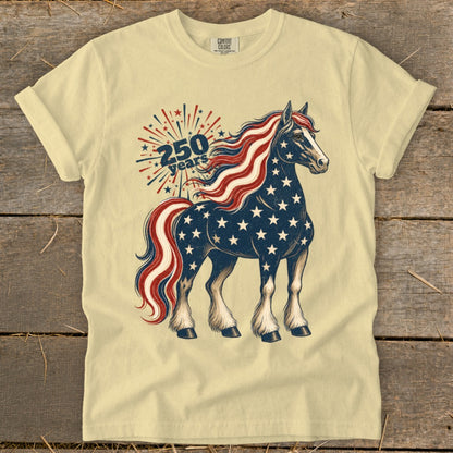 Horse with American flag pattern and 250 years text on a light yellow t-shirt.