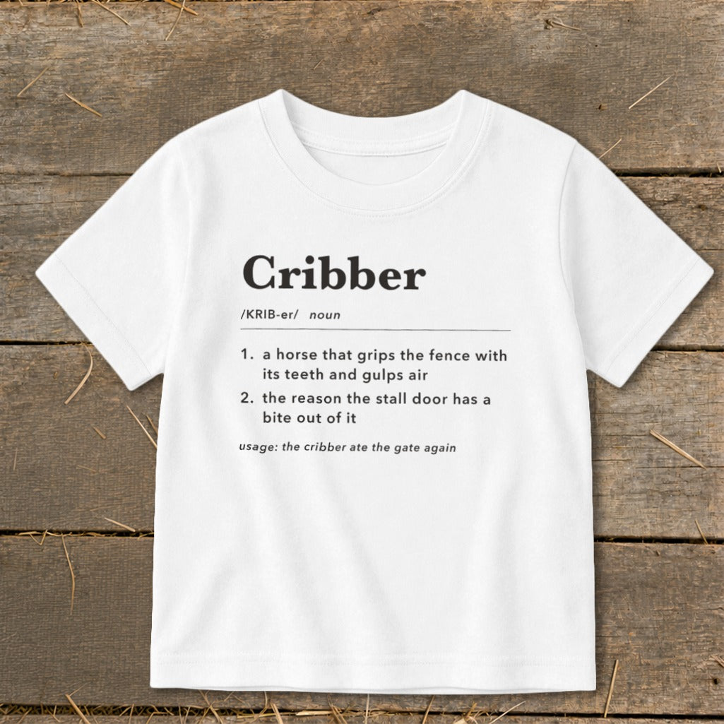 White short-sleeved t-shirt with a humorous dictionary definition of the word cribber printed on the front.