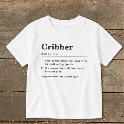 White short-sleeved t-shirt with a humorous dictionary definition of the word cribber printed on the front.