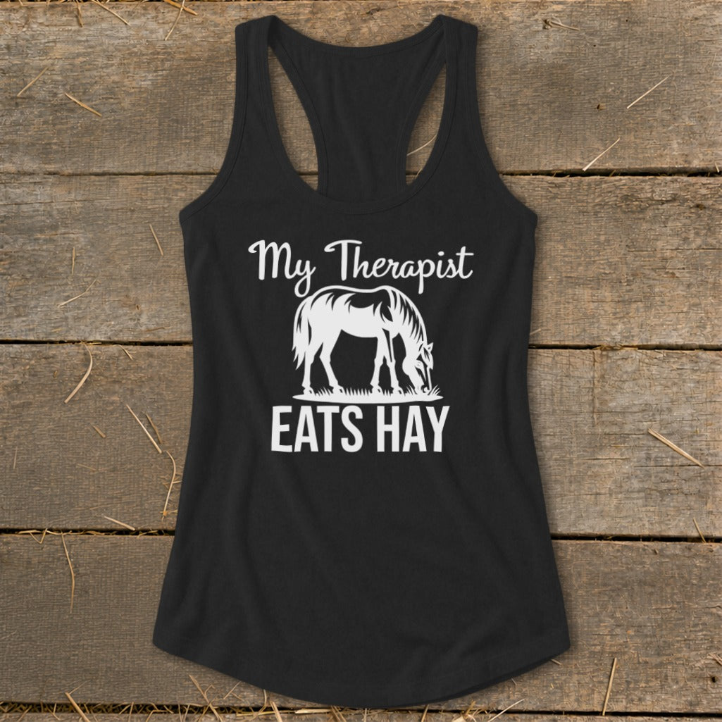 Black tank top with white graphic: "My Therapist Eats Hay" and a horse.