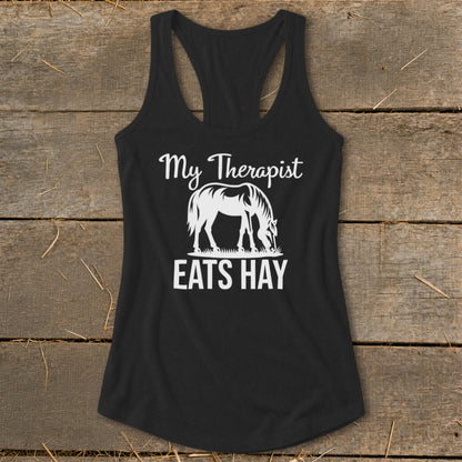 Black tank top with white graphic: "My Therapist Eats Hay" and a horse.