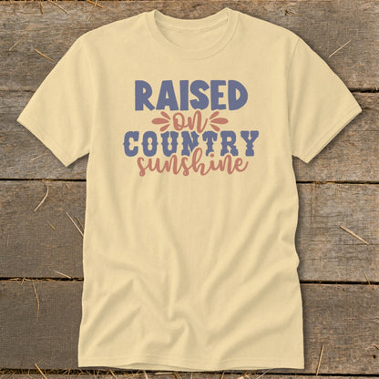 Light yellow t-shirt with "Raised on Country Sunshine" graphic.