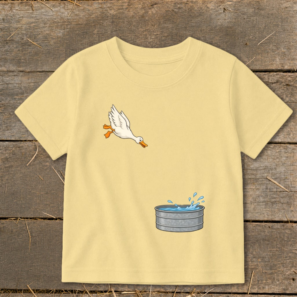 Yellow t-shirt with a cartoon duck jumping into a water trough graphic.