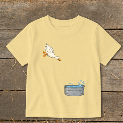 Yellow t-shirt with a cartoon duck jumping into a water trough graphic.