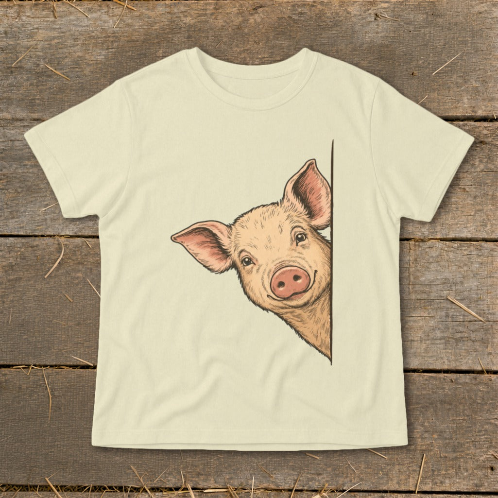 Illustration of a pig peeking from the side on a cream t-shirt.