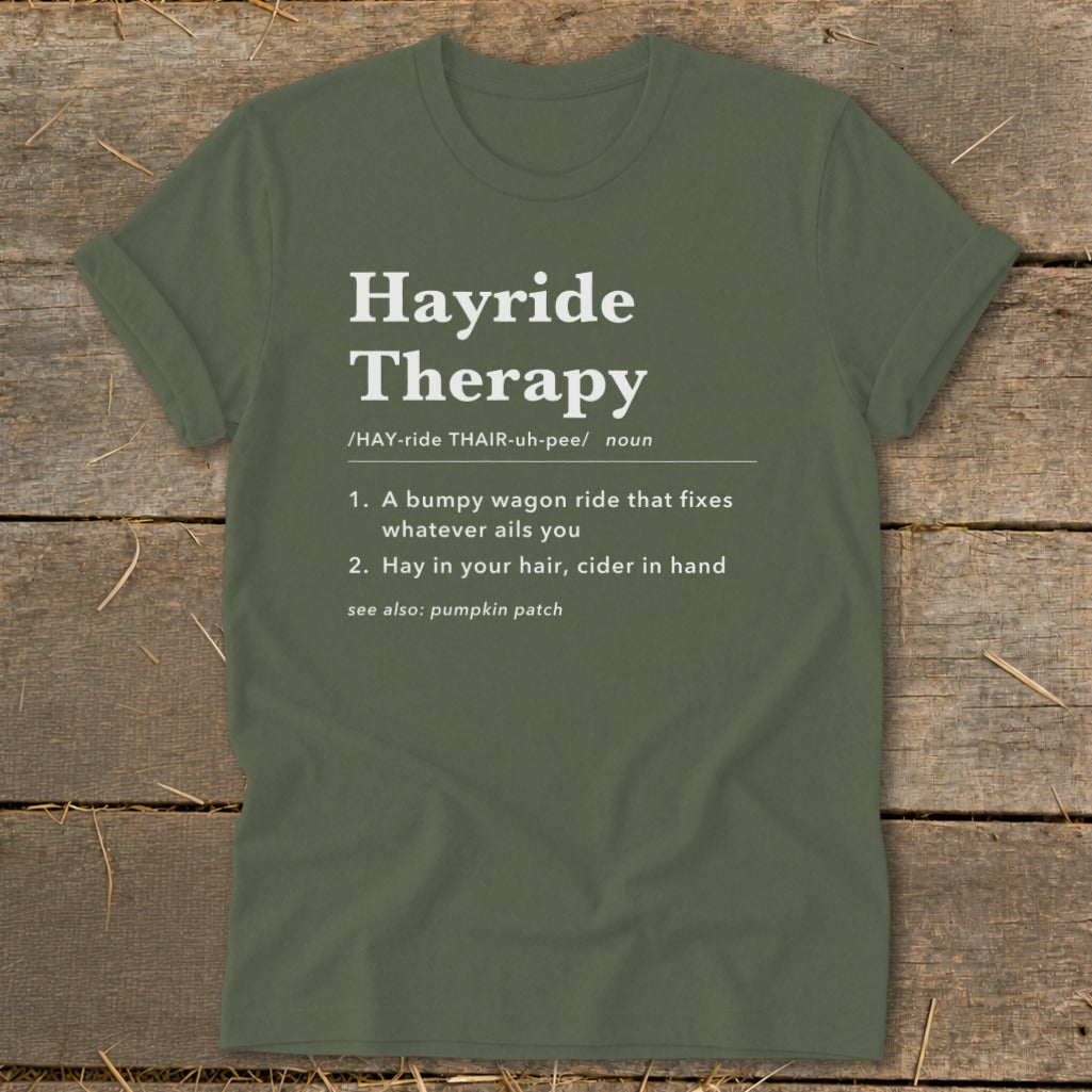 Olive green t-shirt with "Hayride Therapy" definition printed in white text.