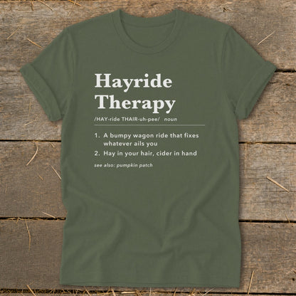 Olive green t-shirt with "Hayride Therapy" definition printed in white text.