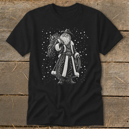 Black t-shirt with a cowboy Santa Claus graphic holding a sack and rope.