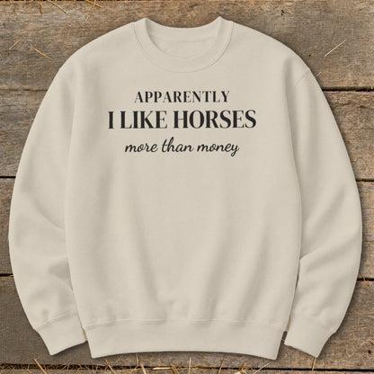 Cream sweatshirt with black text "Apparently I Like Horses more than money".