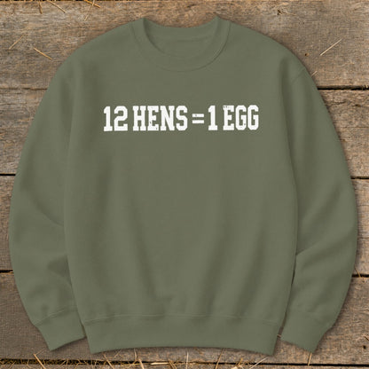 Olive green crewneck sweatshirt featuring the white distressed text 12 HENS = 1 EGG centered on the chest.