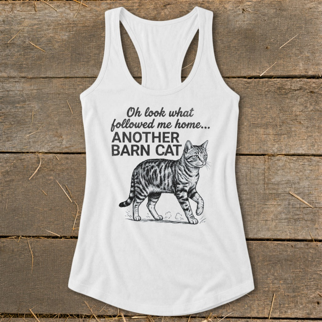 White tank top with a tabby cat illustration and the text "Oh look what followed me home... ANOTHER BARN CAT".